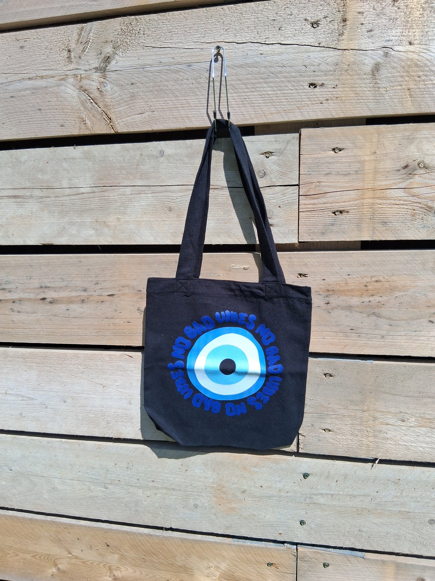 Protect Your Aura: Evil Eye Black Cotton Tote Bag by Kazana